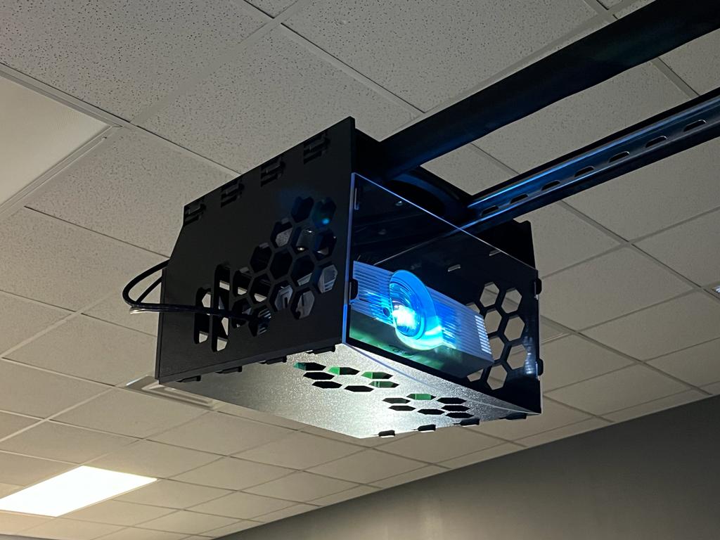 A hanging protective cage for golf simulator projectors.